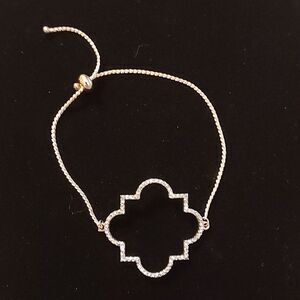 Rose Gold tone Quatrefoil slider bracelet with faux diamonds pave